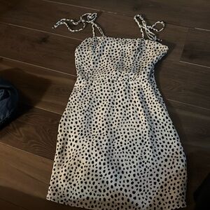 White with black polkadot dress